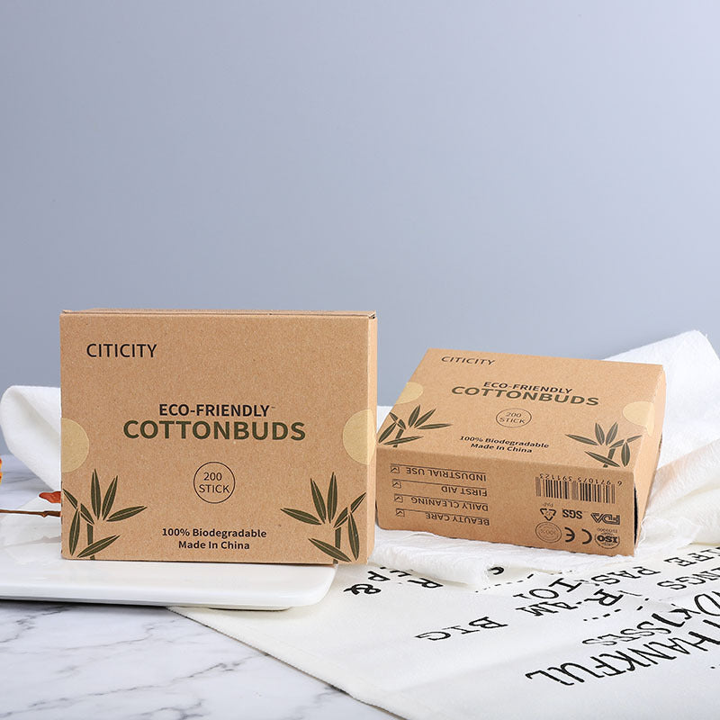 Biodegradable cotton swabs in eco-friendly kraft paper box made from bamboo and cotton — sustainable zero-waste alternative to plastic Q-tips.
